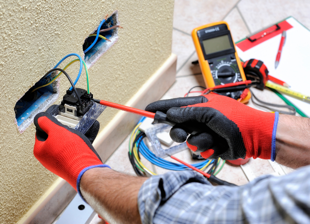 professional electrician repairing home wire