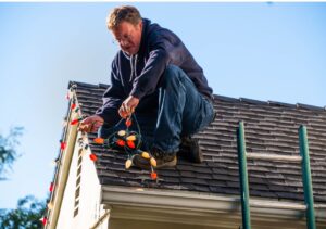 Trusted GTA Electrician on the roof installing 